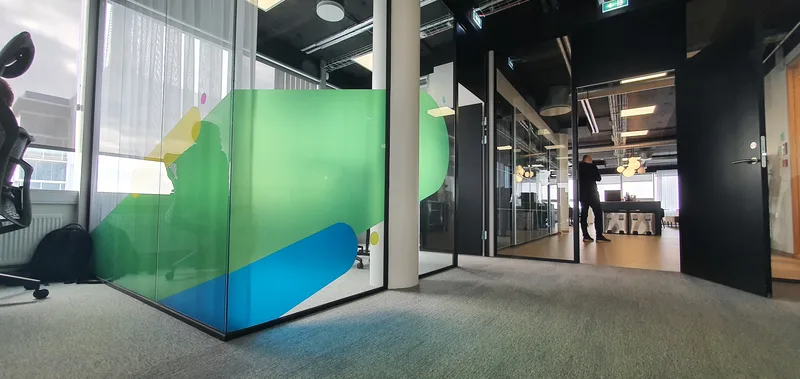 Colourful printed film on meeting-room glass at Sidekick
